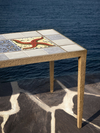 Marlo Laz Dreaming of Cadaqués coffee table with wooden surface and sleek metal legs, modern home interior decor piece.