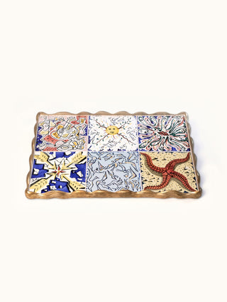 Marlo Laz Dreaming of Cadaqués tray featuring a colorful, artistic design for home decor, shown on a wooden surface.
