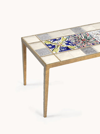 Marlo Laz Dreaming of Cadaqués coffee table with a sleek wooden surface and modern design, placed in a stylish living room setting.