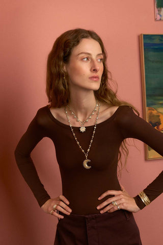 Model wearing southwestern heart choker and the southwestern moon and sun necklace