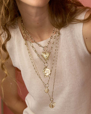 close-up of model wearing all multi link chains