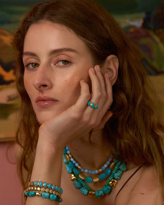Model wearing turquoise jewelry