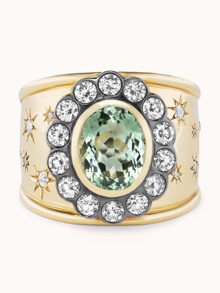 Gold cigar band ring with mint tourmaline and star designs