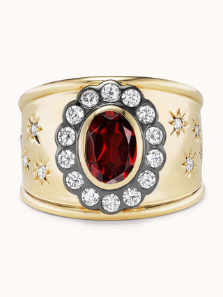 Gold cigar band ring with garnet and star designs