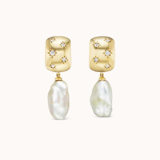 Gold earrings with star-shaped diamonds and baroque pearl drops
