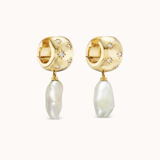Gold hoop earrings with star-shaped diamonds and baroque pearl drops