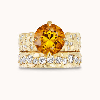 Gold ring with a citrine gemstone and smaller diamonds
