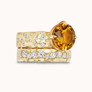 Gold ring with a citrine gemstone and smaller diamonds