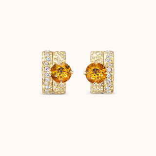 Gold earrings with a citrine gemstone and smaller diamonds