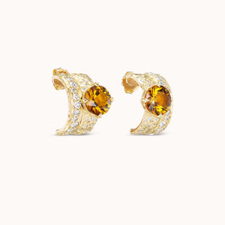Gold earrings with a citrine gemstone and smaller diamonds
