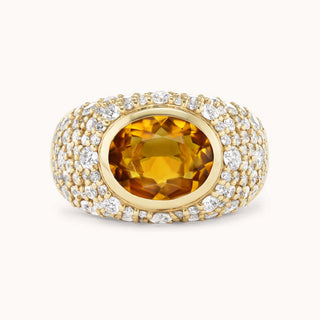 Gold ring with a citrine gemstone and pave diamonds