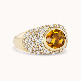 Gold ring with a citrine gemstone and pave diamond accents 