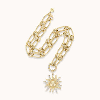 Gold necklace with a sun pendant
