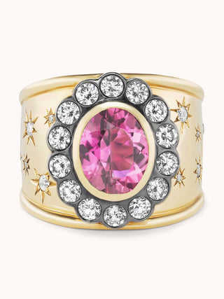 Gold cigar band ring with pink tourmaline and star designs