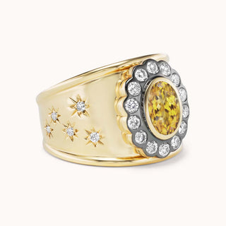 side view of gold cigar band ring with citrine and star designs