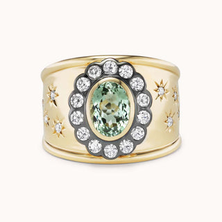 Gold cigar band ring with mint tourmaline and star designs