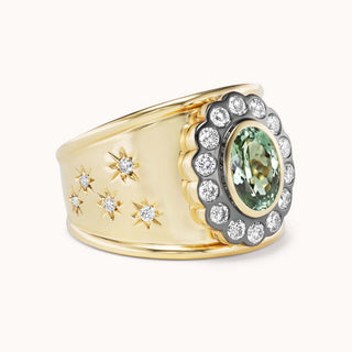 side view of cigar band ring with mint tourmaline and star designs