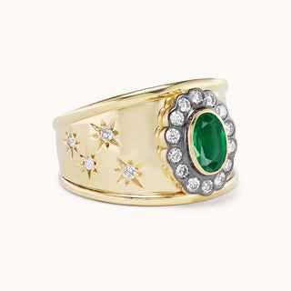 side view of gold cigar band ring with emerald and star designs