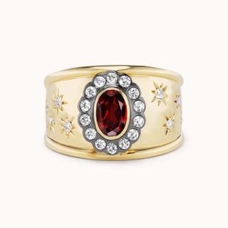 Gold cigar band ring with garnet and star designs