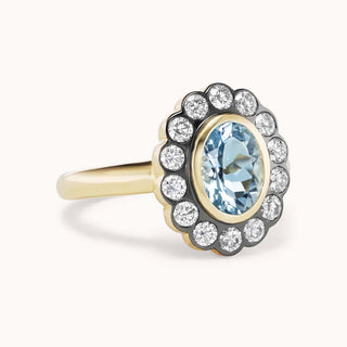 Side view of aquamarine ring with diamond halo