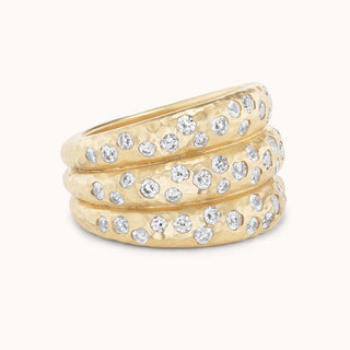 Three attached hammered stacking bands with pave diamonds
