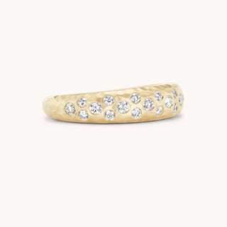 Side view hammered gold ring with pave diamonds